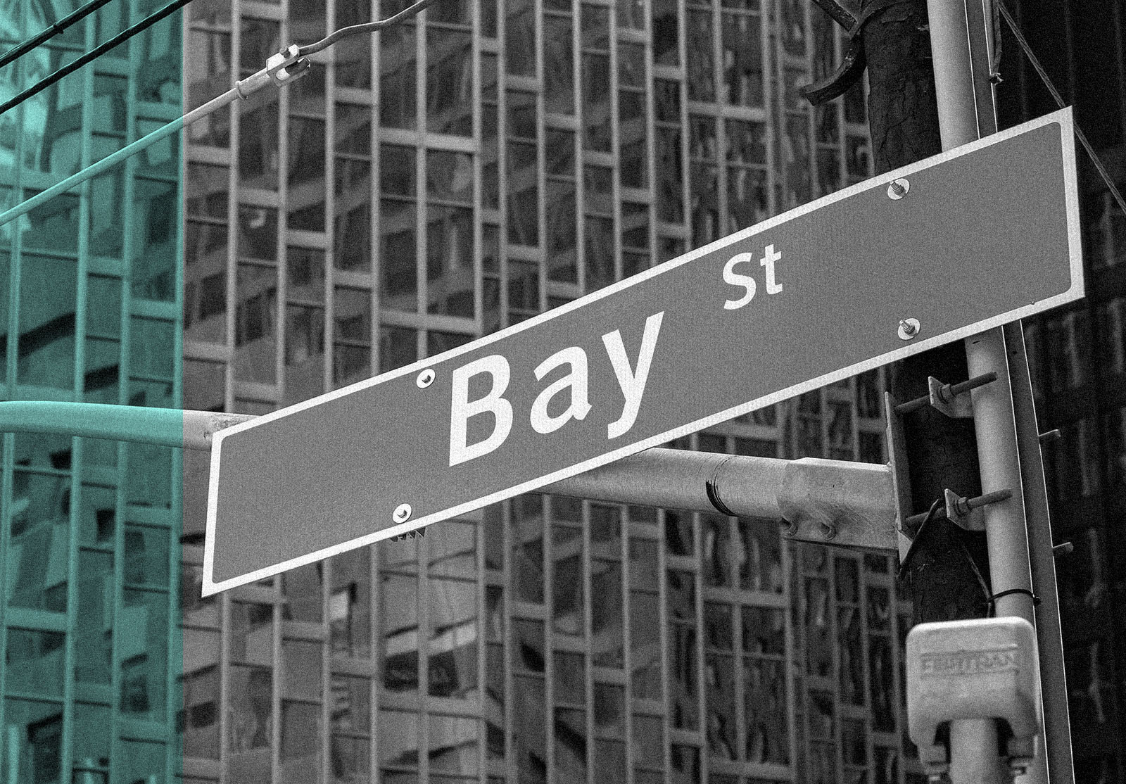 Bay Street sign with glass wall of a bank building in background